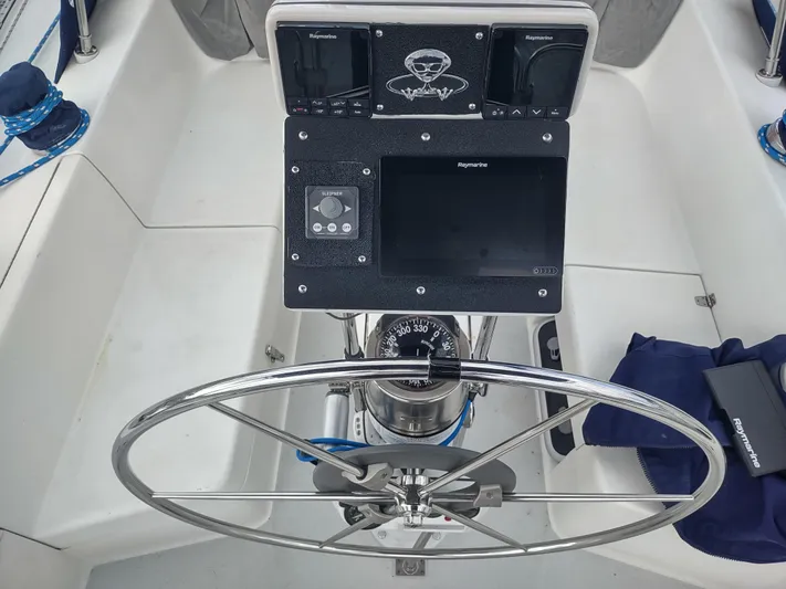 Bluebird Yacht Photos Pics Steering wheel and navigation equipment on a 2002 Catalina 36 MkII sailboat.