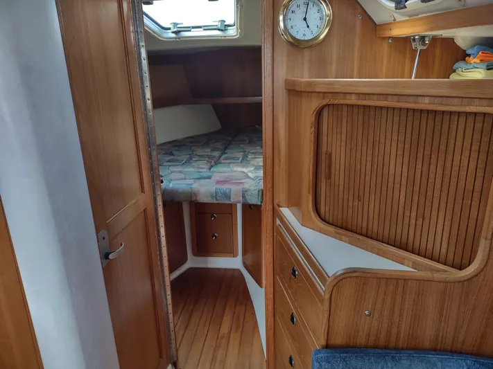 Bluebird Yacht Photos Pics Interior of a 2002 Catalina 36 MkII sailboat, featuring a cozy cabin with wooden finishes.