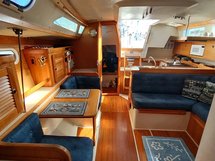 Bluebird Yacht Photos Pics Interior of 2002 Catalina 36 MkII sailboat with wood finish and blue upholstery.