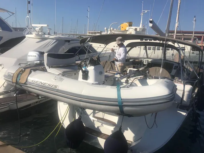  Yacht Photos Pics 2015 Jeanneau 57 yacht docked with inflatable Genesis boat on deck.