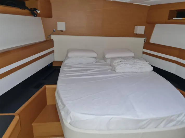  Yacht Photos Pics Cabin interior of 2015 Jeanneau 57 yacht with neatly made bed.