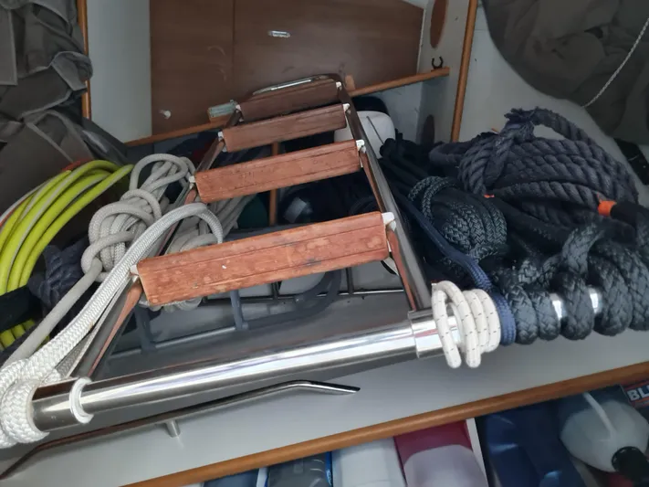  Yacht Photos Pics Storage area with ropes and ladder on a 2015 Jeanneau 57 sailboat.