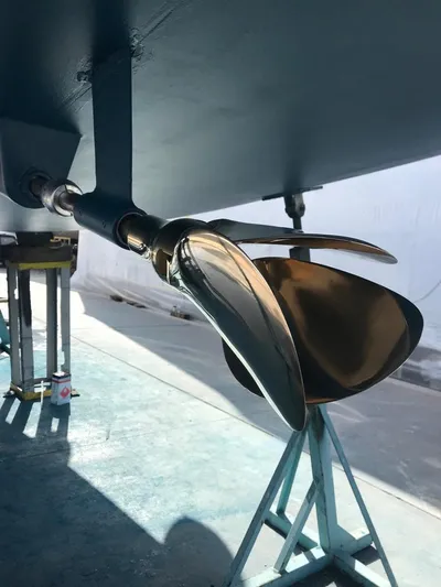  Yacht Photos Pics Close-up of a 2015 Jeanneau 57 sailboat propeller in a shipyard.