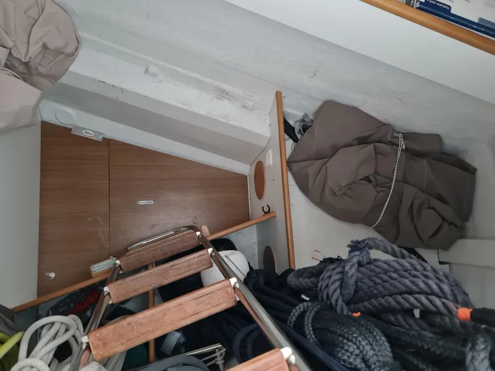  Yacht Photos Pics Interior storage area of a 2015 Jeanneau 57 sailboat with ropes and equipment.
