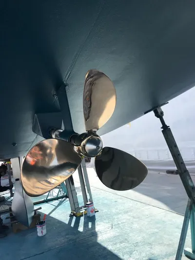  Yacht Photos Pics Shiny propeller of a 2015 Jeanneau 57 sailboat, dockside view.