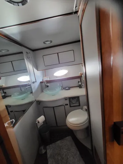 Dunn It Again Yacht Photos Pics Bathroom interior of 1997 McKinna 48' Pilot House yacht with modern fixtures.