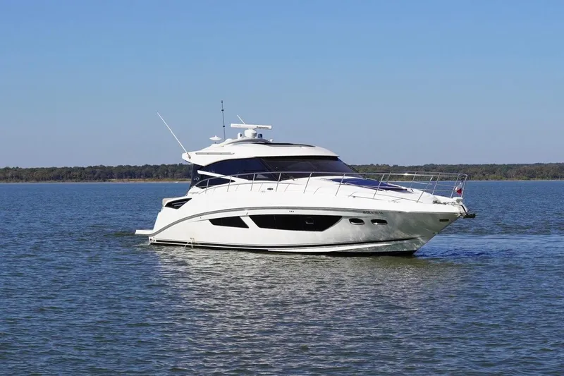  Yacht Photos Pics 2015 Sea Ray 470 Sundancer yacht cruising on a calm lake.