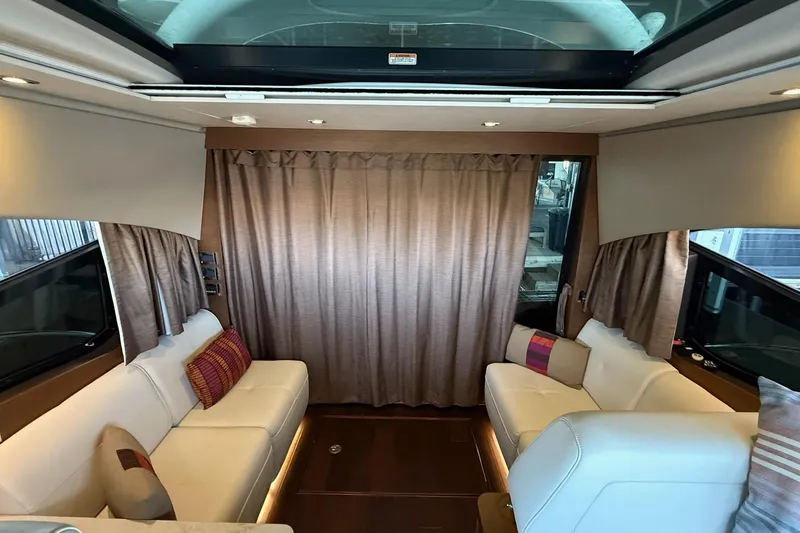  Yacht Photos Pics Luxurious interior of 2015 Sea Ray 470 Sundancer yacht with plush seating and elegant decor.
