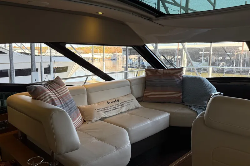  Yacht Photos Pics Interior of 2015 Sea Ray 470 Sundancer yacht with cozy seating and decorative pillows.