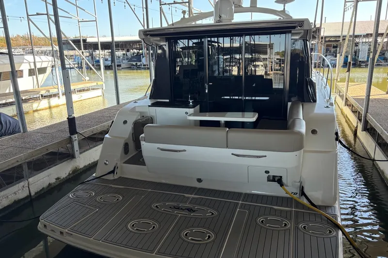  Yacht Photos Pics 2015 Sea Ray 470 Sundancer yacht docked, showcasing spacious rear deck and seating area.