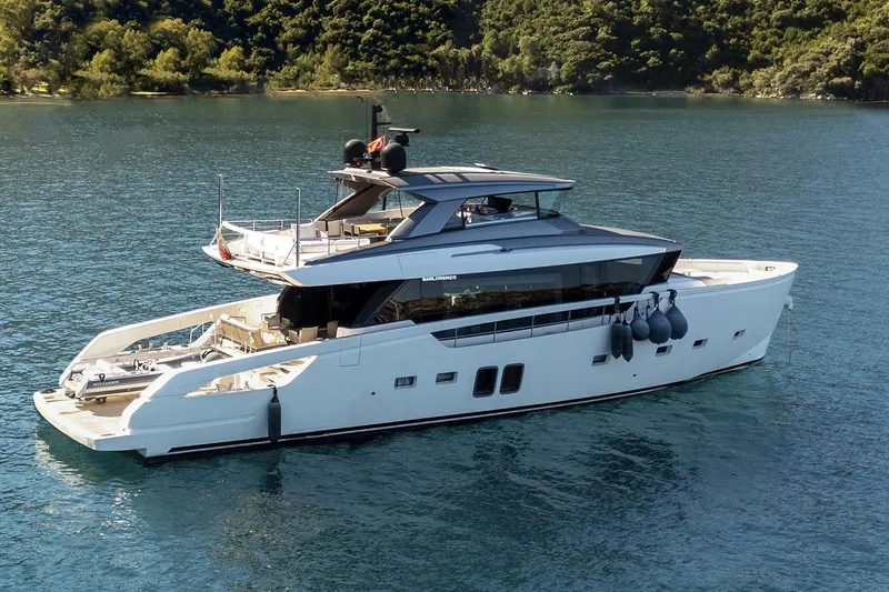  Yacht Photos Pics Luxurious 2023 Sanlorenzo SX76 yacht cruising on serene waters.