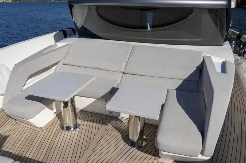  Yacht Photos Pics Luxurious seating area on 2023 Sanlorenzo SX76 yacht with sleek design and ocean view.