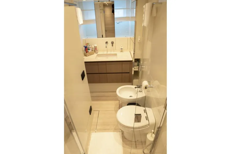  Yacht Photos Pics Modern bathroom in 2023 Sanlorenzo SX76 yacht with sleek fixtures and elegant design.