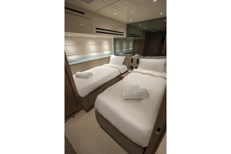  Yacht Photos Pics Luxurious twin bedroom in 2023 Sanlorenzo SX76 yacht, featuring modern design and elegant lighting.