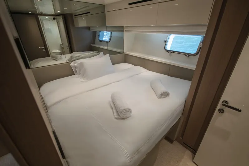  Yacht Photos Pics Luxurious bedroom interior of 2023 Sanlorenzo SX76 yacht with ocean view.
