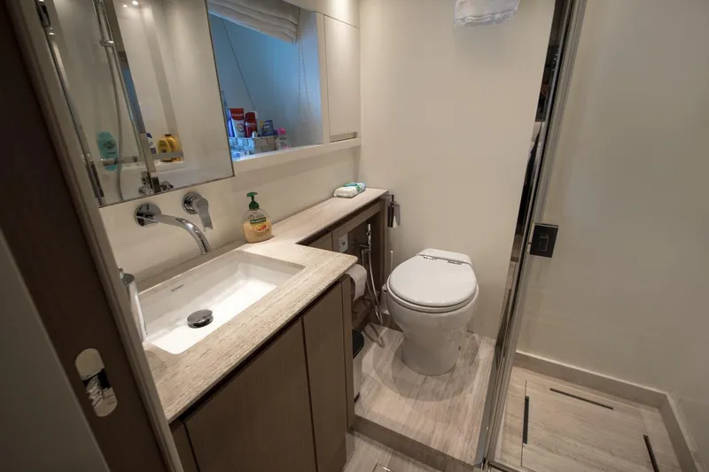  Yacht Photos Pics Luxurious bathroom in 2023 Sanlorenzo SX76 yacht with modern fixtures and elegant design.