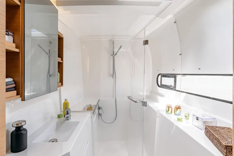  Yacht Photos Pics Modern bathroom in 2026 Excess 11 yacht, featuring sleek design and ample natural light.