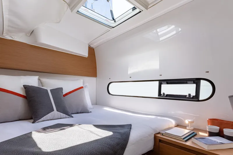  Yacht Photos Pics Luxurious cabin interior of 2026 Excess 11 yacht with cozy bed and modern decor.