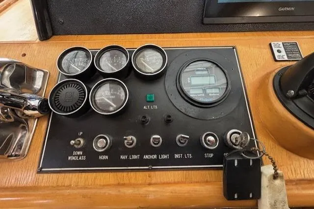 Aqua Billy Yacht Photos Pics Control panel of a 1995 Symbol Super Sedan with gauges and switches.