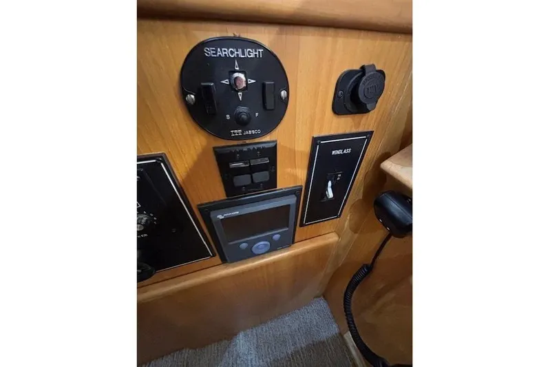 Aqua Billy Yacht Photos Pics Control panel of a 1995 Symbol Super Sedan with searchlight and windlass switches.