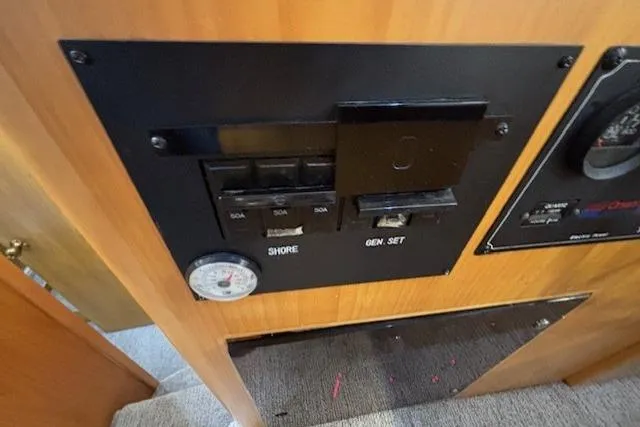 Aqua Billy Yacht Photos Pics Control panel with switches and gauge in a 1995 Symbol Super Sedan vehicle.