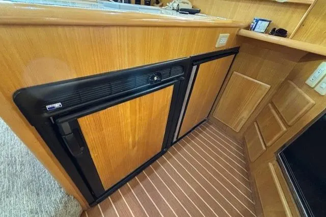 Aqua Billy Yacht Photos Pics Wood-paneled interior with built-in appliances, Symbol Super Sedan 1995.