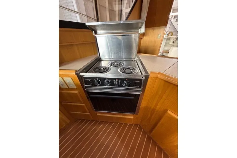 Aqua Billy Yacht Photos Pics Stainless steel stove in a wooden kitchen setting, 1995 Symbol Super Sedan.