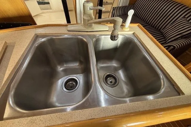 Aqua Billy Yacht Photos Pics Dual stainless steel kitchen sink with modern faucet in a 1995 Symbol Super Sedan.