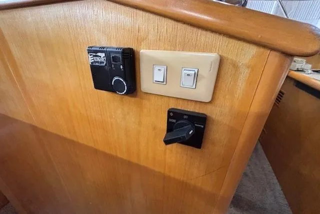 Aqua Billy Yacht Photos Pics Dashboard controls of a 1995 Symbol Super Sedan with switches and dials.