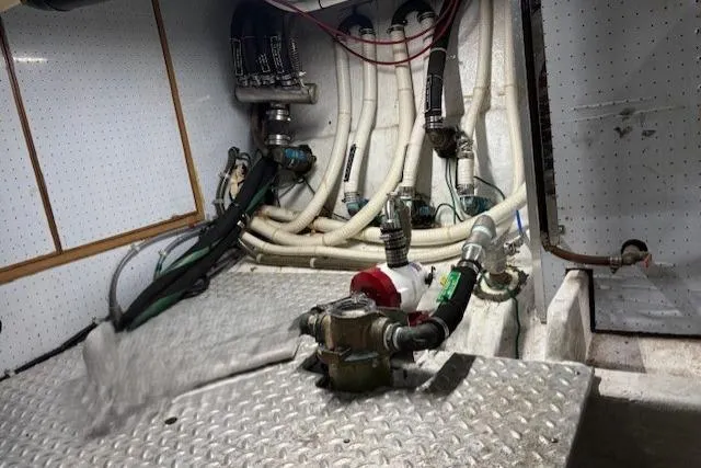 Aqua Billy Yacht Photos Pics Engine compartment of a 1995 Symbol Super Sedan with visible hoses and mechanical components.