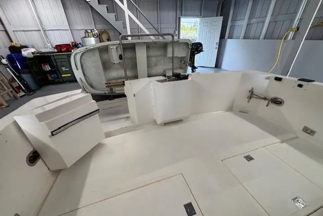 Aqua Billy Yacht Photos Pics Clean boat interior in a garage with tools and equipment.