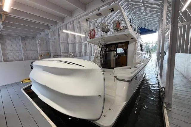 Aqua Billy Yacht Photos Pics A luxury yacht docked in a covered marina, showcasing sleek design and modern amenities.