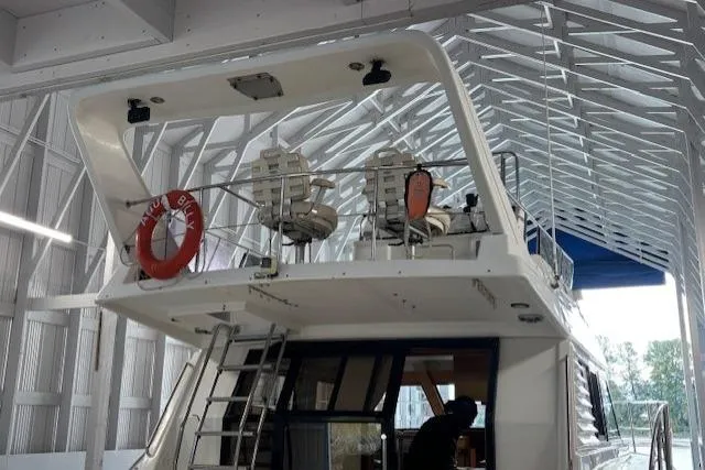 Aqua Billy Yacht Photos Pics Luxury yacht interior with upper deck seating, life preserver, and modern design elements.