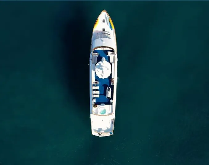 Mi Amor Yacht Photos Pics Aerial view of 1984 DeFever 120 yacht on calm water.