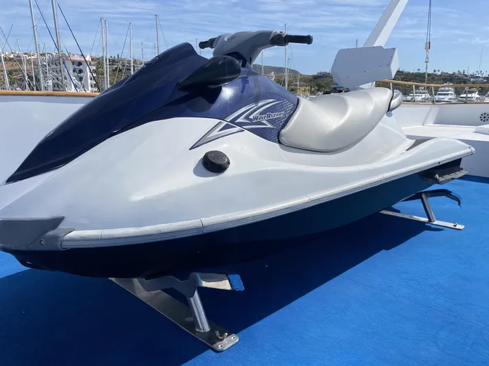 Mi Amor Yacht Photos Pics Jet ski on DeFever 120 yacht, 1984 model, docked at marina with blue deck.