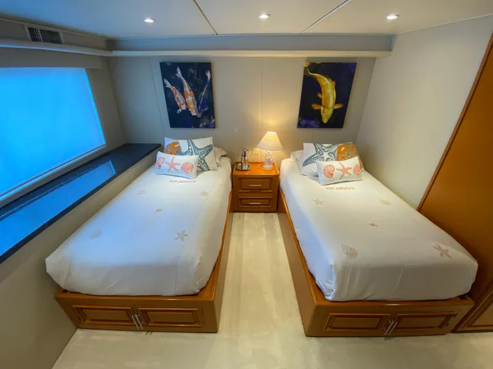 Mi Amor Yacht Photos Pics Twin beds in a 1984 DeFever 120 yacht cabin with nautical decor.
