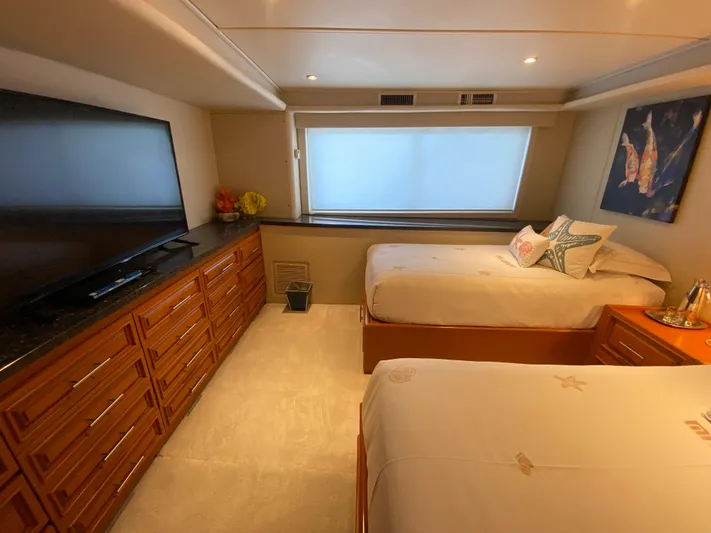 Mi Amor Yacht Photos Pics Luxurious cabin interior of 1984 DeFever 120 yacht with twin beds and modern amenities.