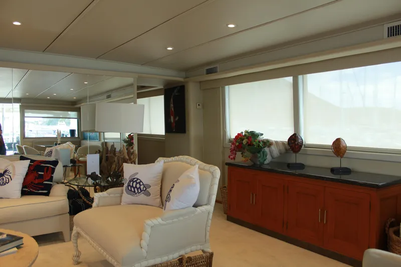 Mi Amor Yacht Photos Pics Luxurious interior of 1984 DeFever 120 yacht with elegant furnishings and decor.