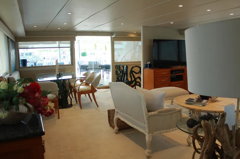 Mi Amor Yacht Photos Pics Luxurious interior of a 1984 DeFever 120 yacht with elegant furnishings and decor.