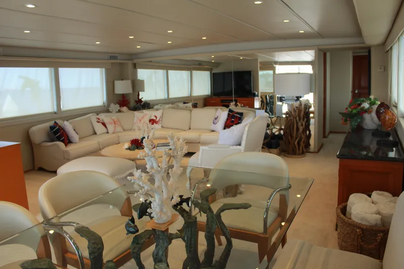 Mi Amor Yacht Photos Pics Luxurious interior of 1984 DeFever 120 yacht with elegant seating and decor.