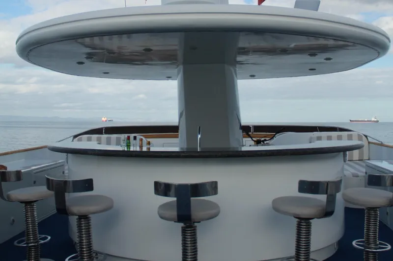 Mi Amor Yacht Photos Pics Outdoor bar area on 1984 DeFever 120 yacht with ocean view.