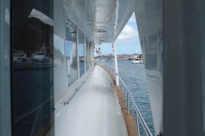 Mi Amor Yacht Photos Pics 1984 DeFever 120 yacht deck view with ocean and marina in the background.