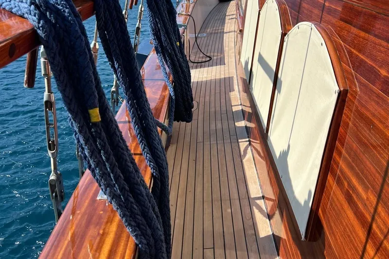  Yacht Photos Pics Polished wooden deck of 1993 Custom Sailing Yacht Ocean Pure with coiled ropes.