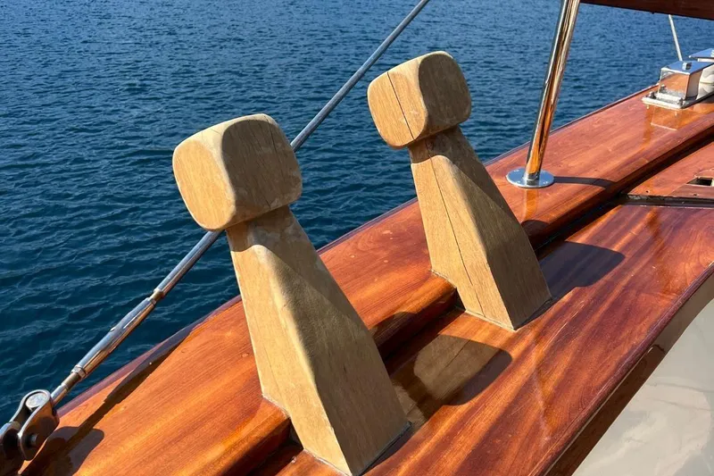  Yacht Photos Pics Wooden deck details on 1993 Custom Sailing Yacht Ocean Pure, overlooking calm blue waters.