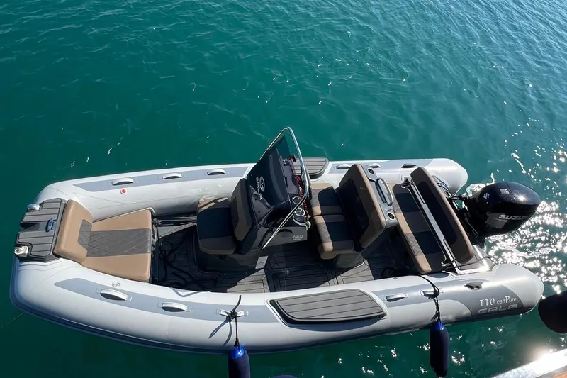  Yacht Photos Pics Custom Sailing Yacht Ocean Pure 1993 with Suzuki outboard motor on clear blue water.