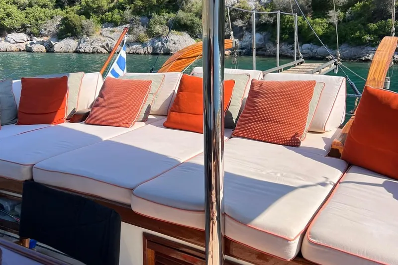  Yacht Photos Pics Luxurious deck seating on 1993 Custom Sailing Yacht Ocean Pure with vibrant cushions.