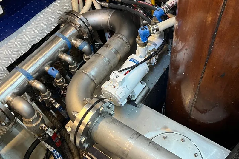  Yacht Photos Pics Engine room of 1993 Custom Sailing Yacht Ocean Pure, featuring complex piping and machinery.