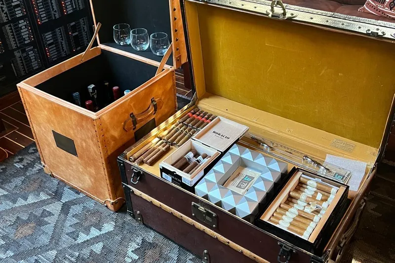  Yacht Photos Pics Luxurious yacht interior with cigar and wine storage, featuring elegant leather cases.