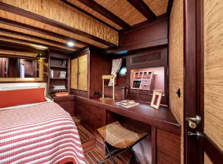  Yacht Photos Pics Luxurious cabin interior of 1993 Custom Sailing Yacht Ocean Pure with wooden decor and cozy furnishings.