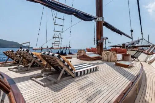  Yacht Photos Pics Luxurious deck of 1993 Custom Sailing Yacht Ocean Pure with sun loungers and ocean view.